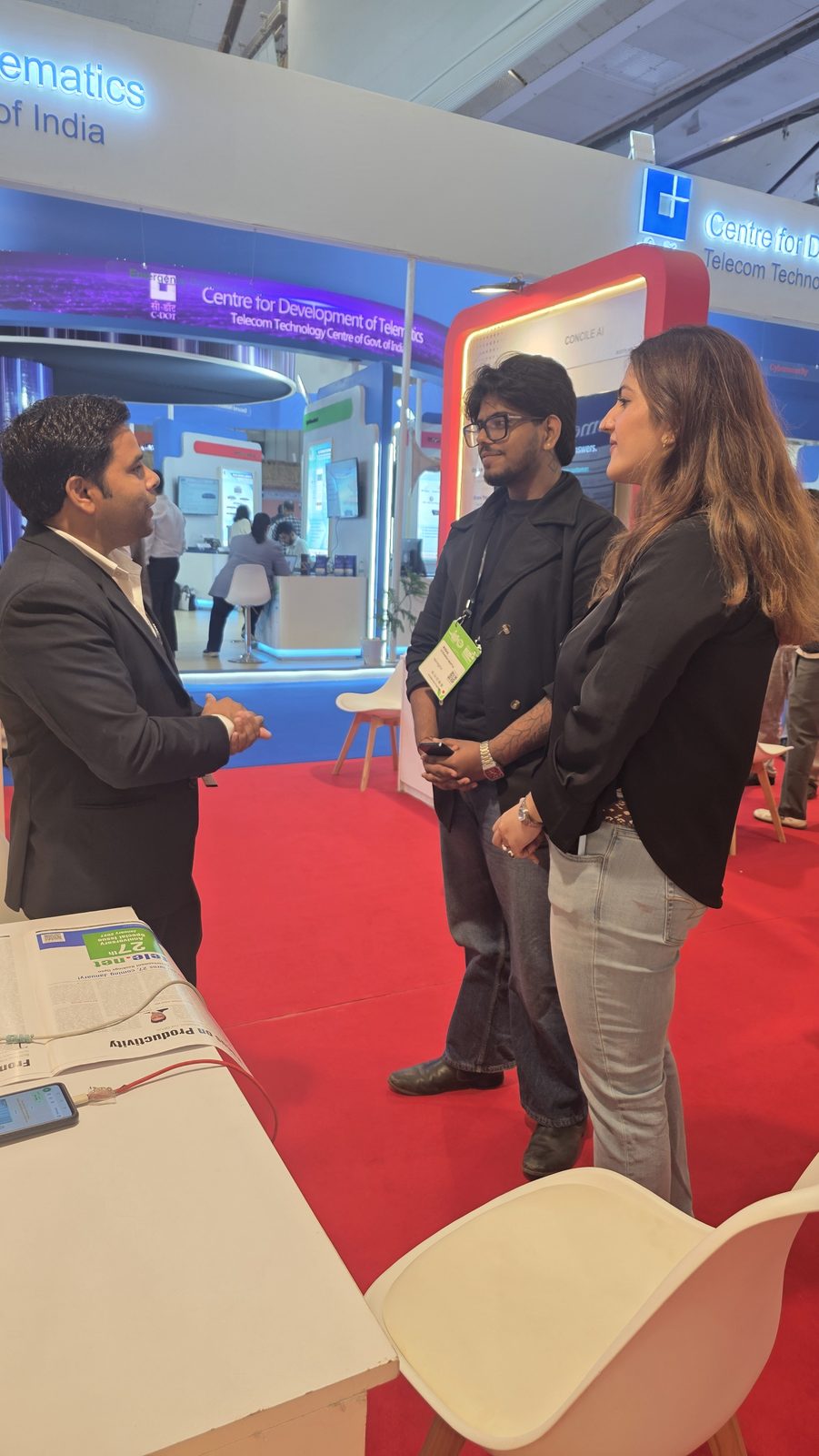 A conversation beside the Kabad Hatao booth.