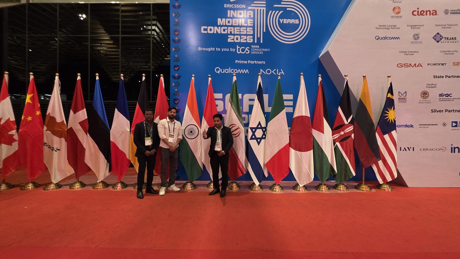 Team members at the IMC 10 Years wall.