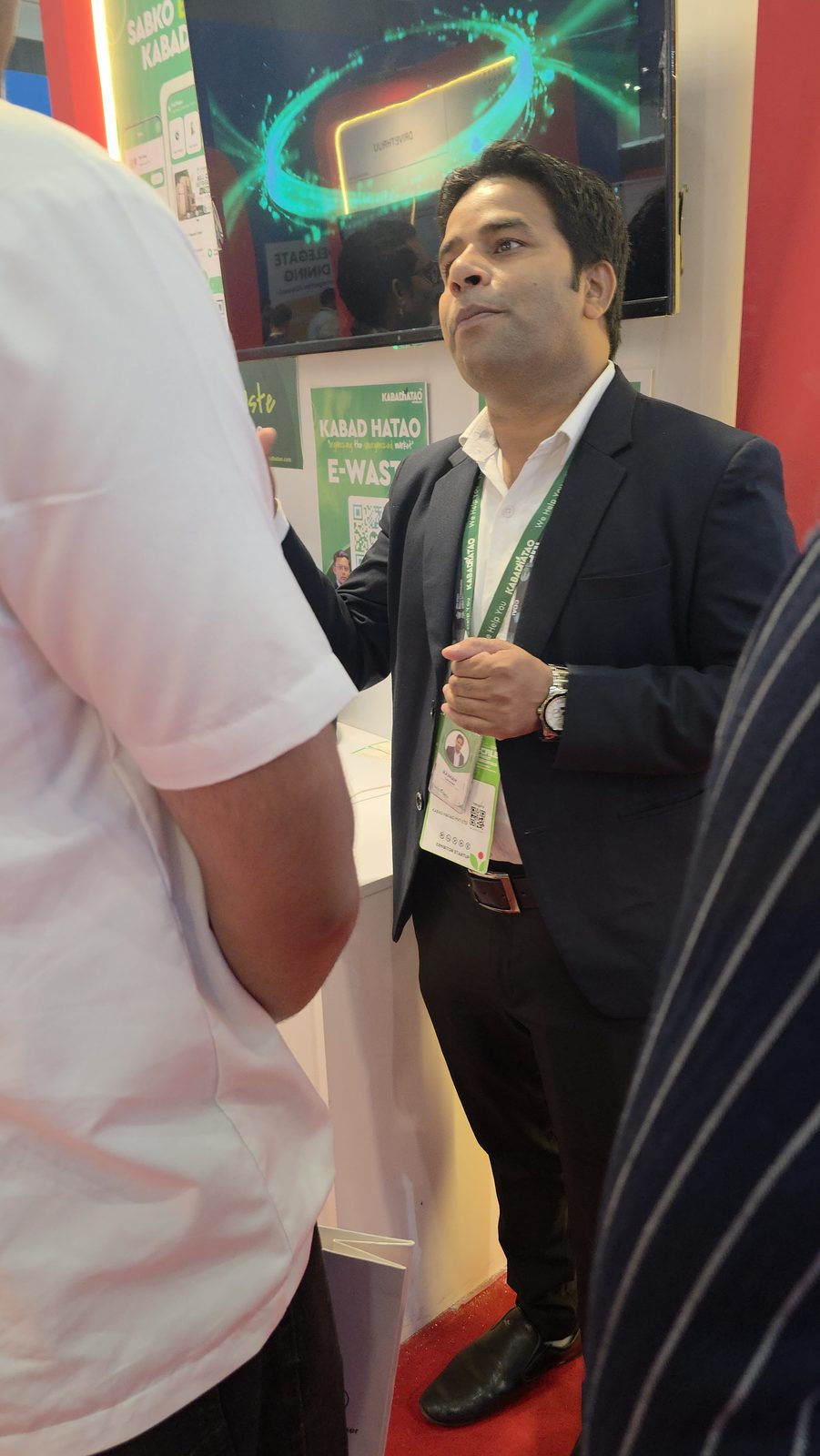 Visitors talking with the team at booth AI-155.