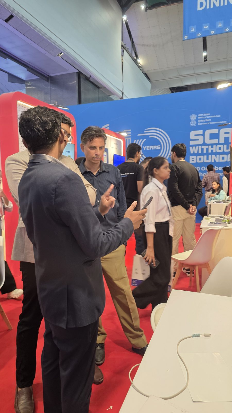 A discussion beside the stall screen.