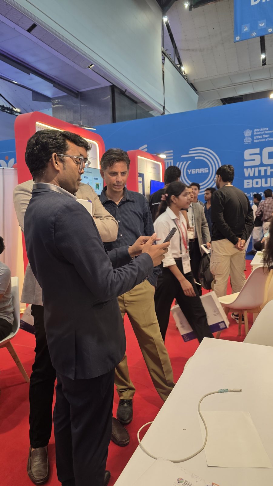 Another conversation at booth AI-155 on day 3.