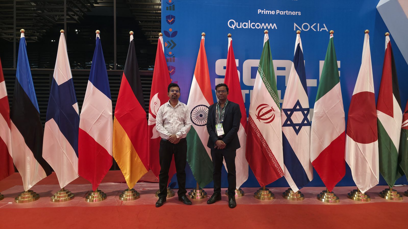 The team with the international flags at IMC.