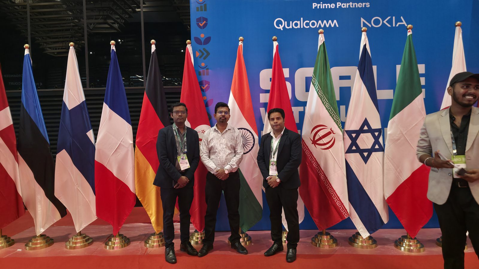 The team with the international flags at IMC.