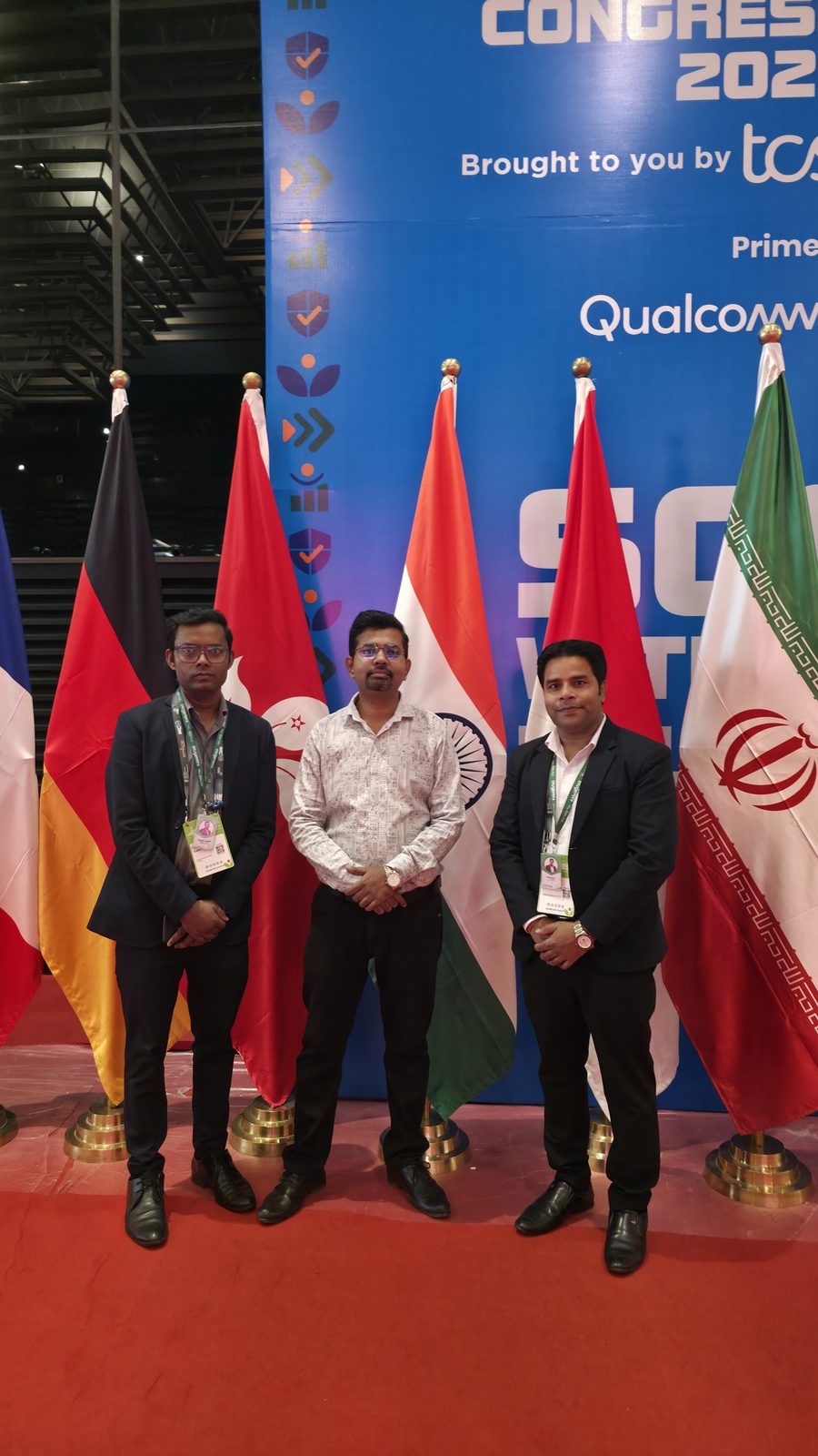 The team with the international flags at IMC.