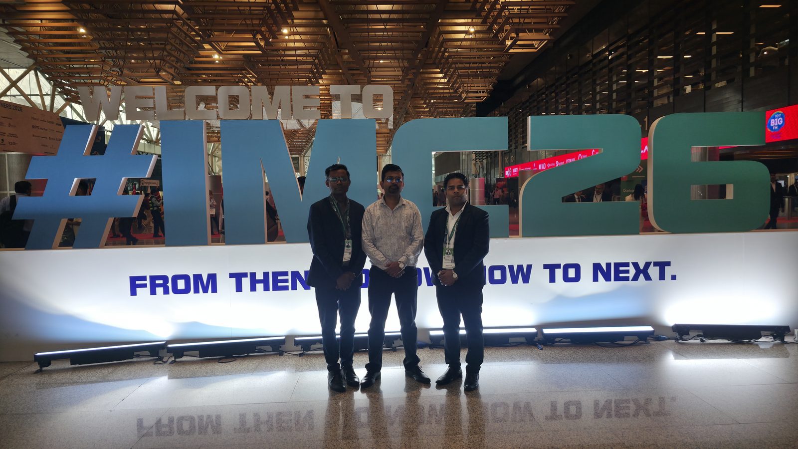 Teammates in front of 10 Years of Innovation.