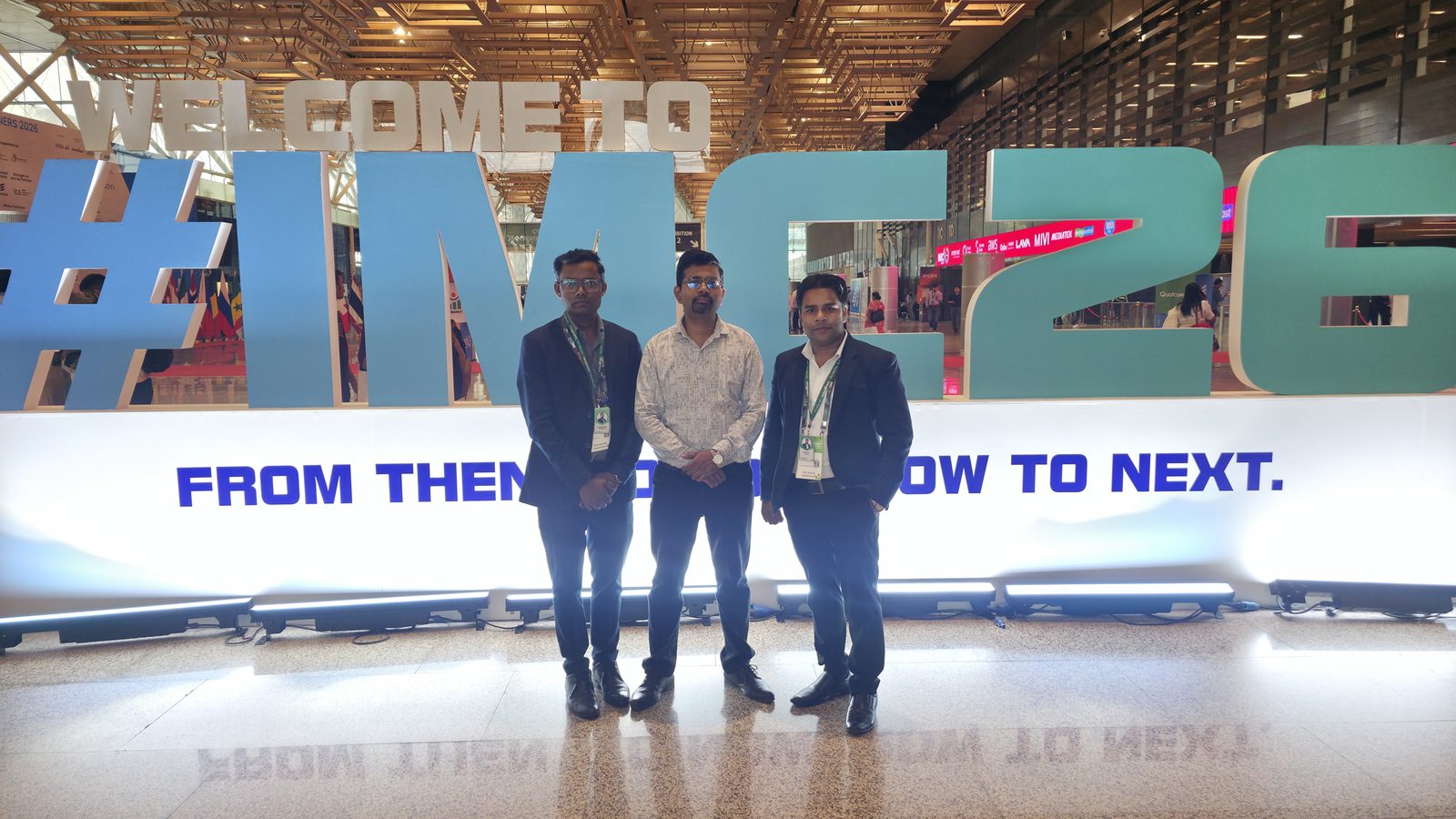 The team at the IMC 10 Years wall.