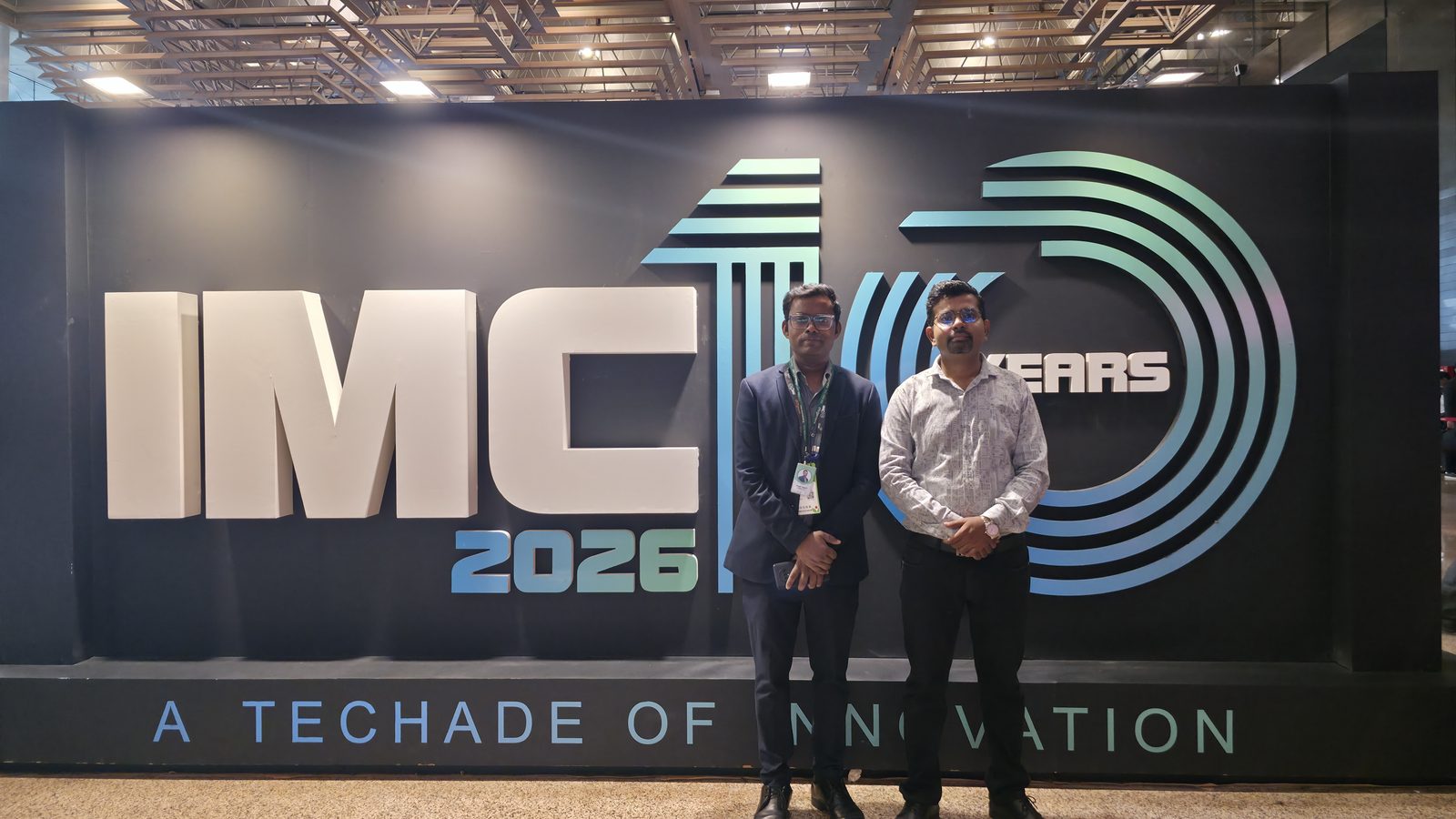 Teammates in front of 10 Years of Innovation.