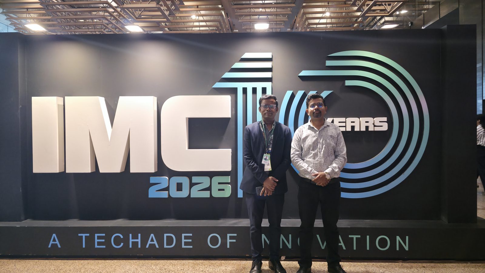 The team at the IMC 10 Years wall.
