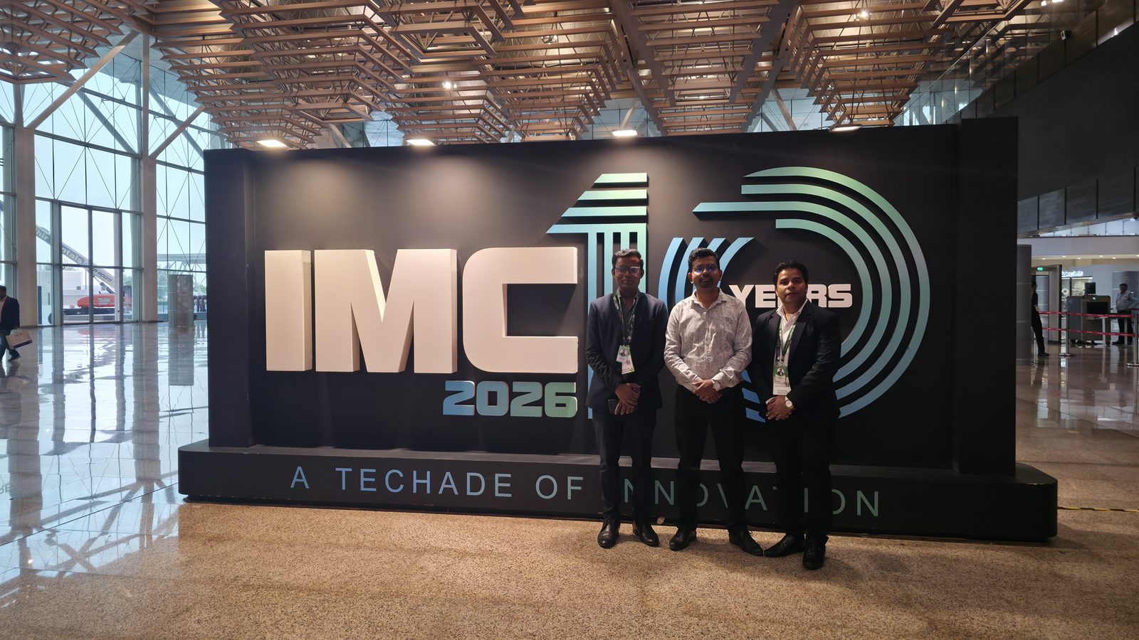 Teammates in front of 10 Years of Innovation.