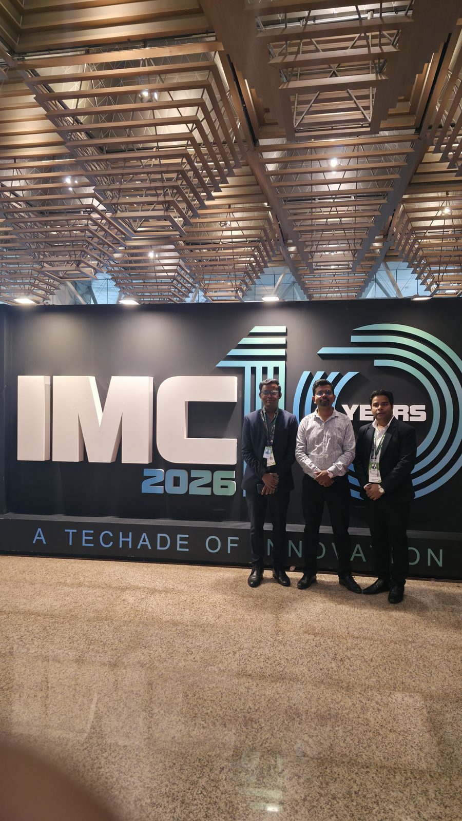 Teammates in front of 10 Years of Innovation.