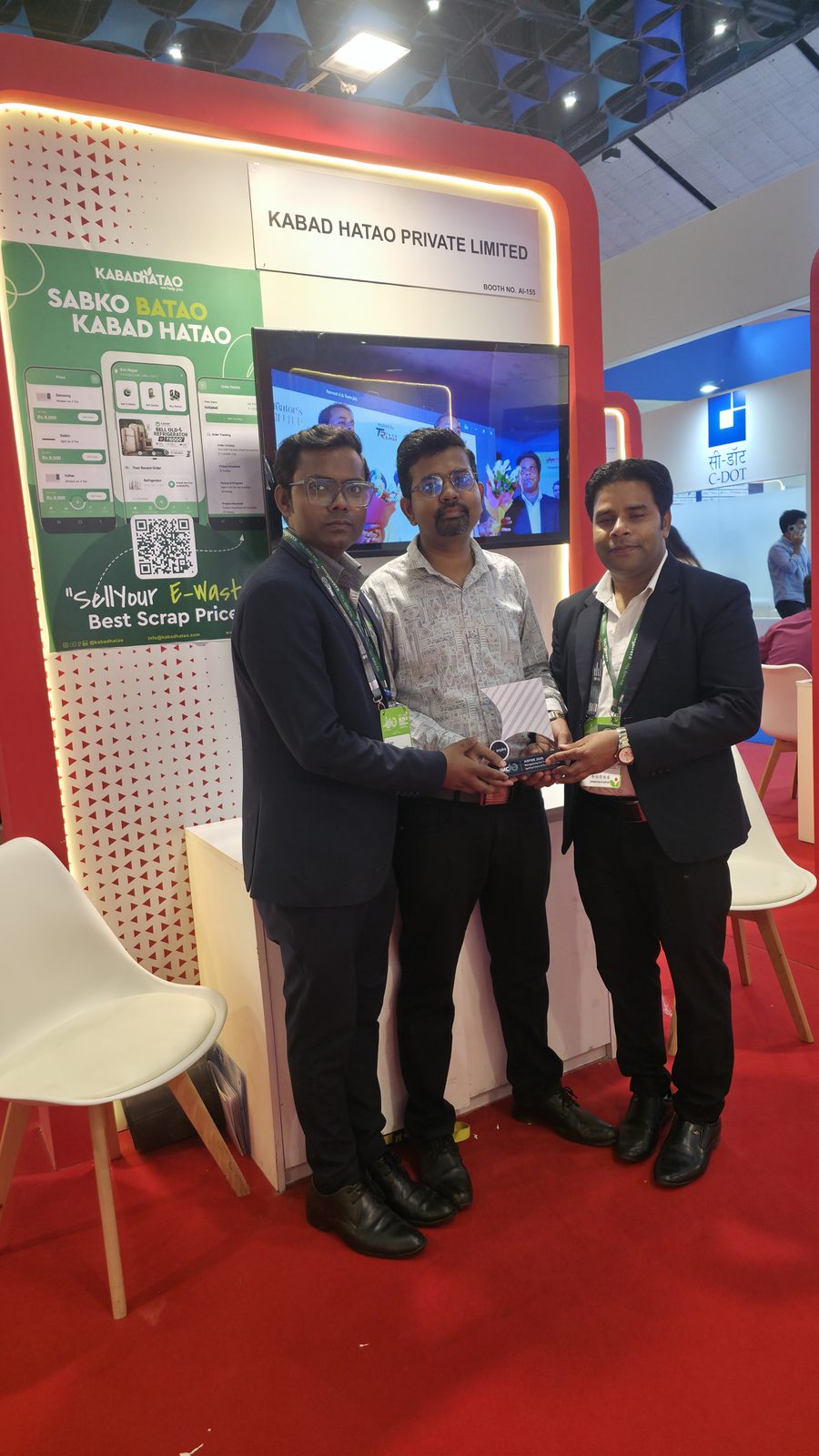 Teammates in front of the Kabad Hatao stall.