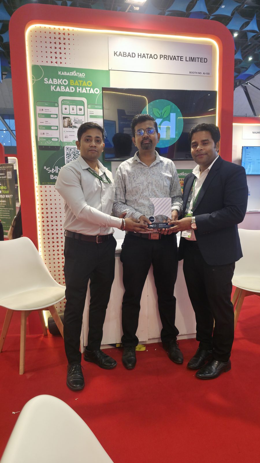 Teammates in front of the Kabad Hatao stall.