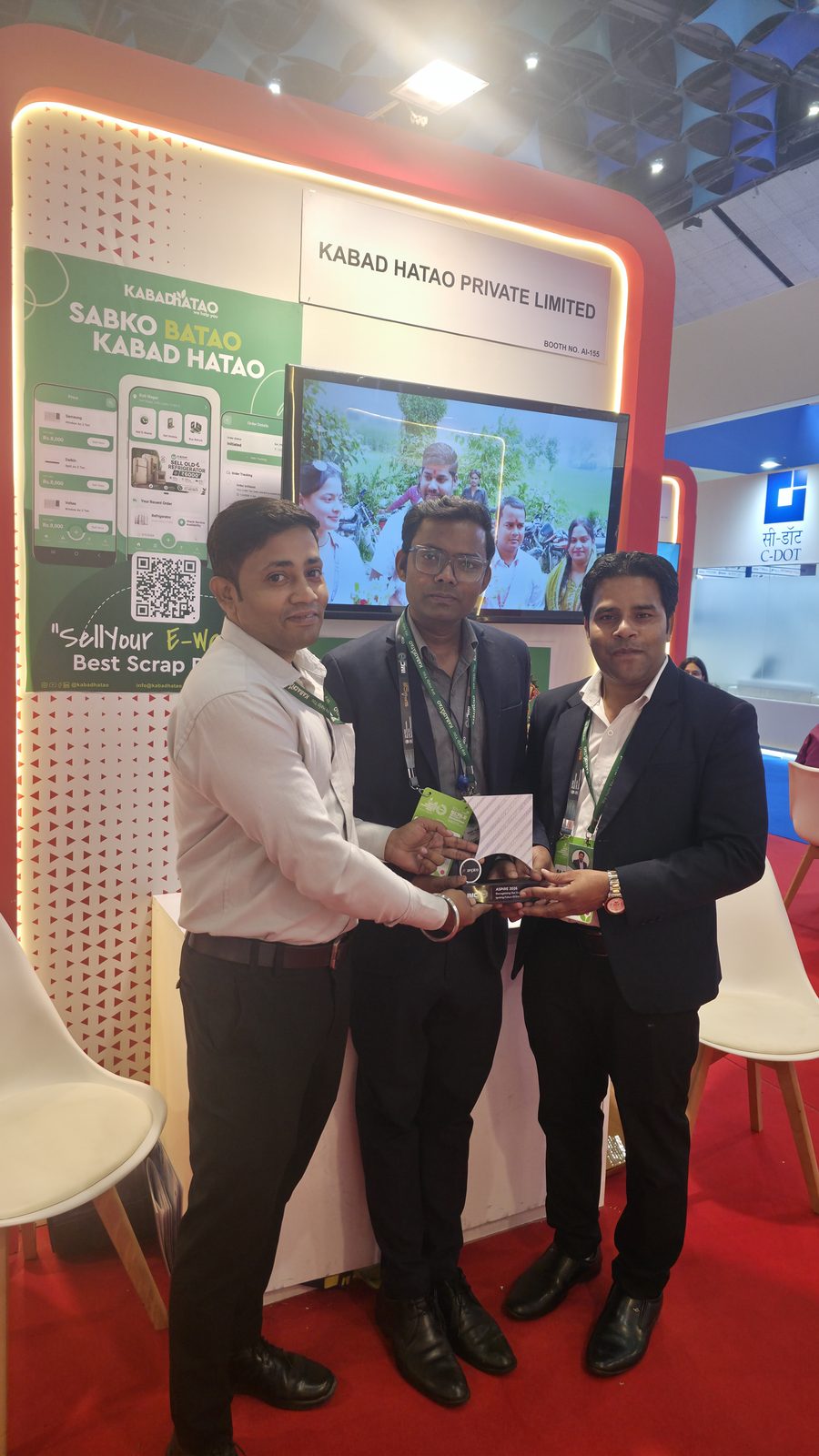 Teammates in front of the Kabad Hatao stall.